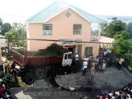 THREE KILLED AS TRUCK SLAMS INTO SUPERMARKET