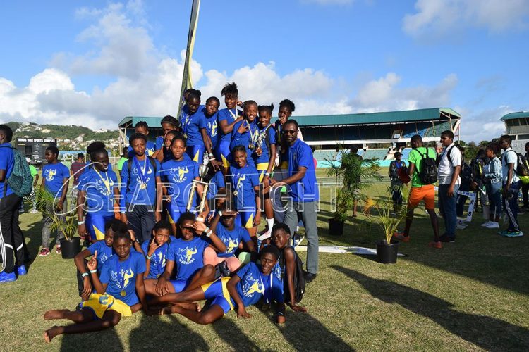 New females champion – The Barrouallie Secondary School athletes savour their moment of glory