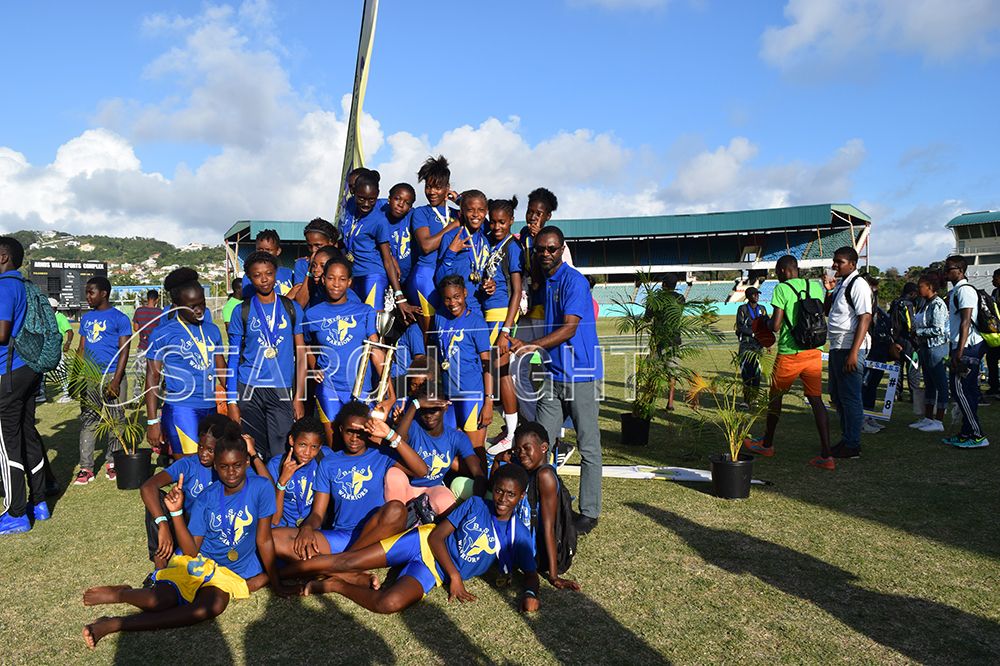 New females champion – The Barrouallie Secondary School athletes savour their moment of glory