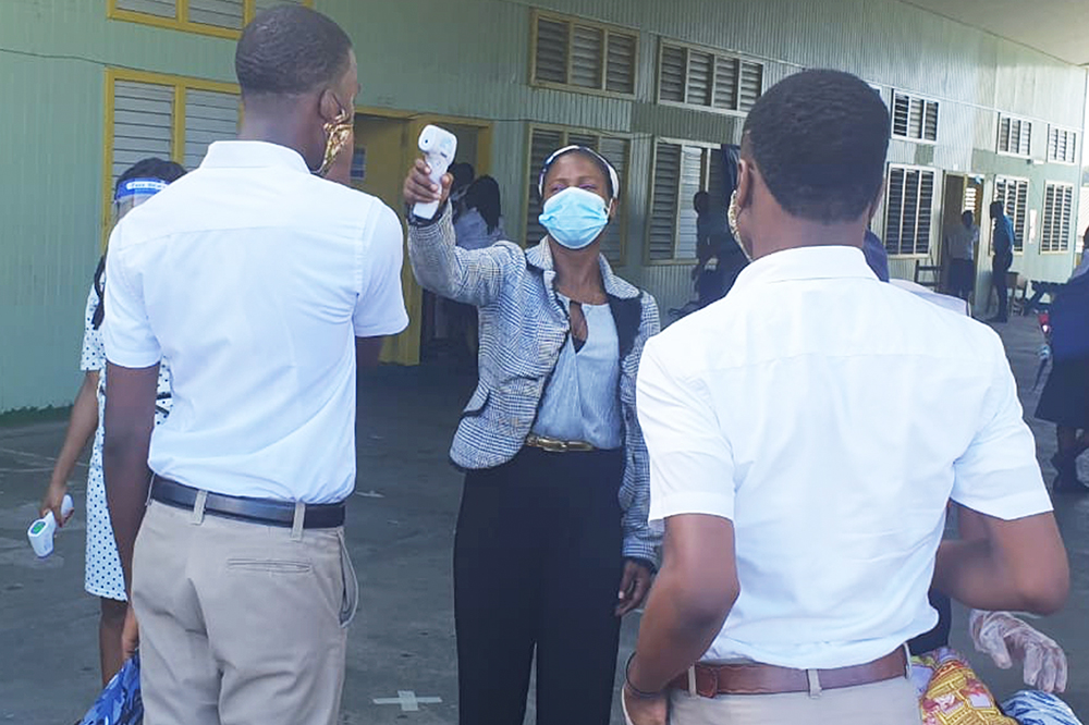 Teachers volunteer to do temperature checks