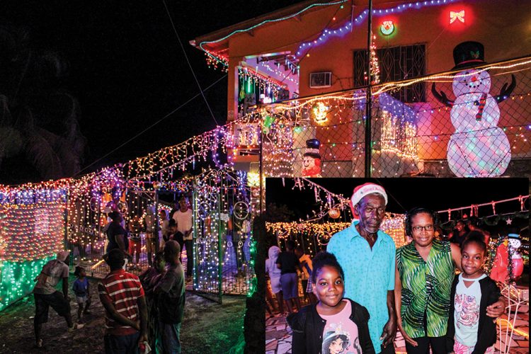 Samuel flips the switch on his Christmas lights